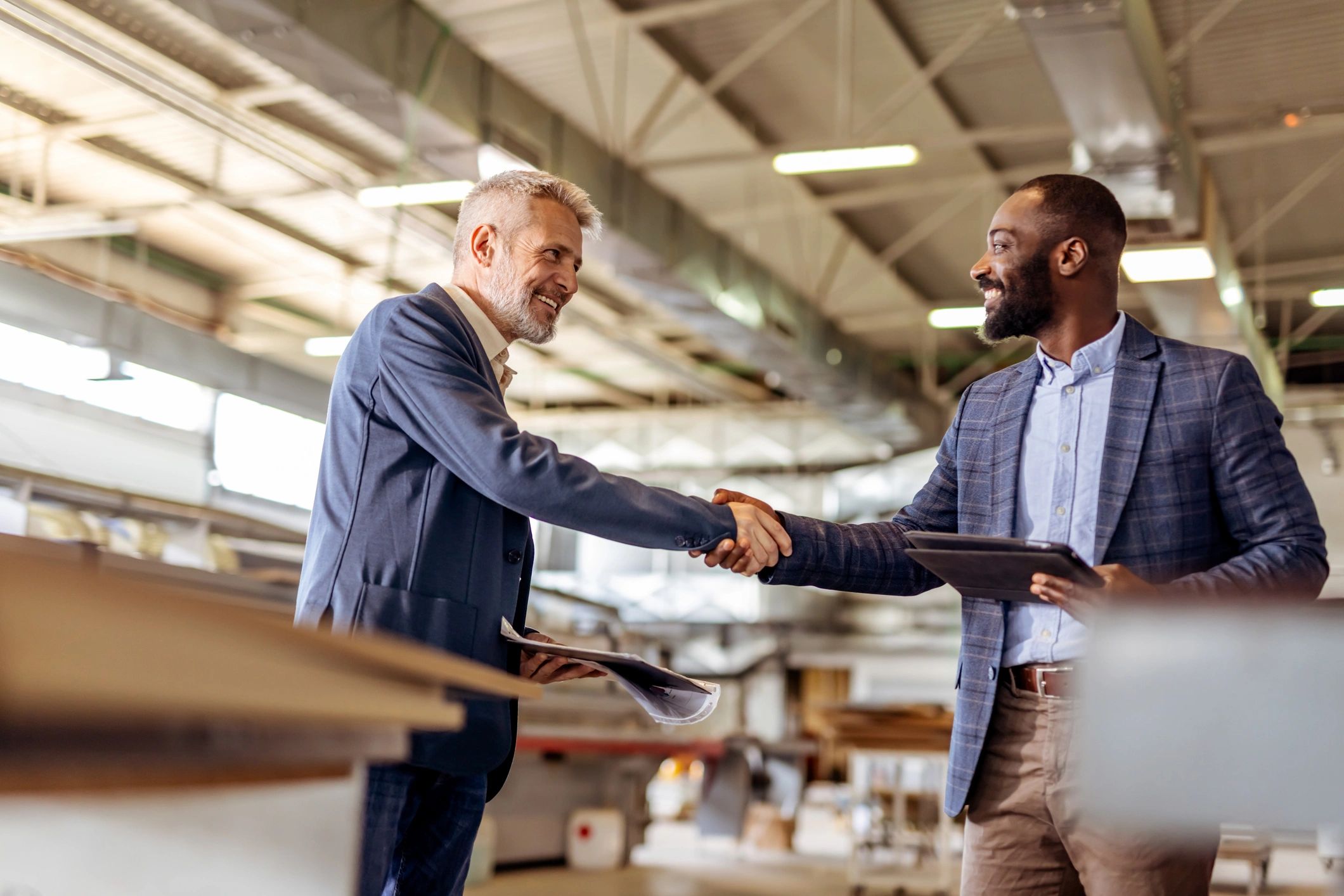 Business professionals meeting and shaking hands