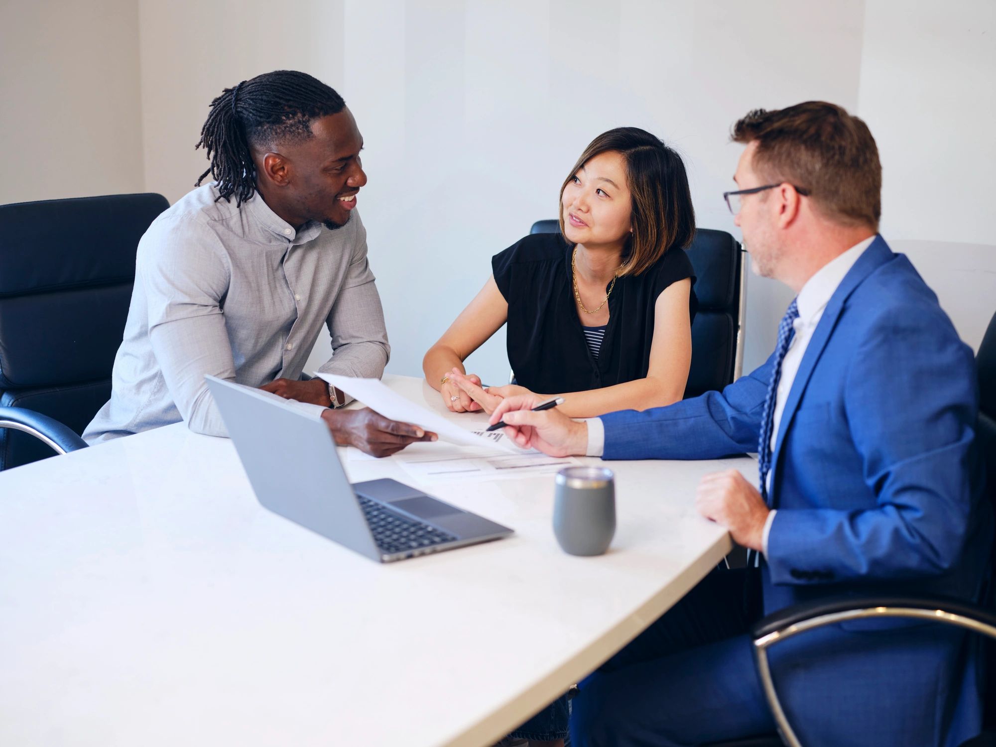 Business meeting with financial advisor reviewing documents