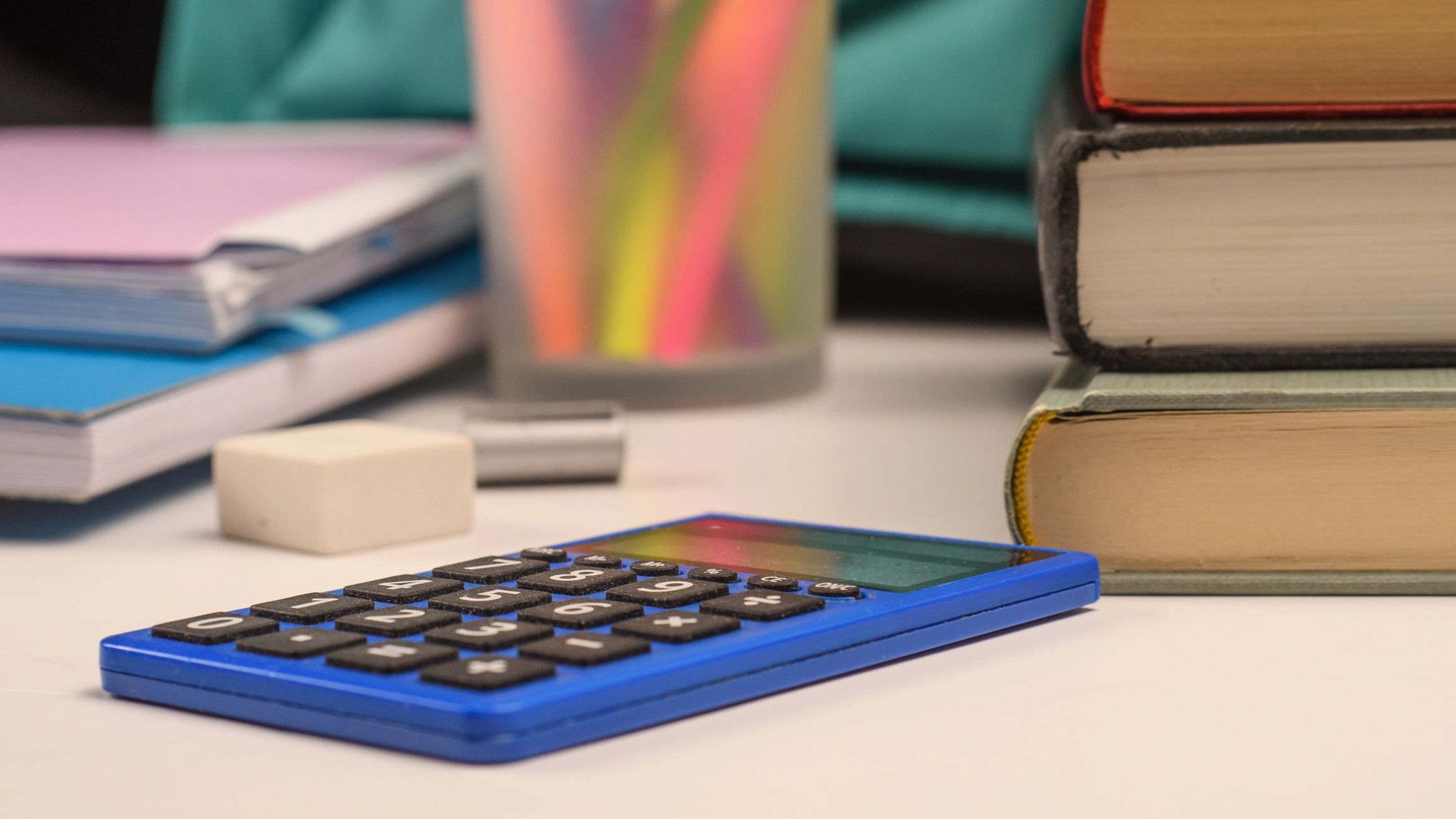 Calculator and financial stationery on desk