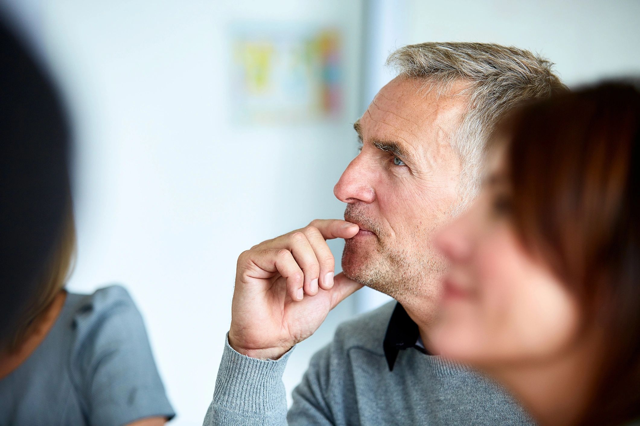 Colleagues listening during an office presentation
